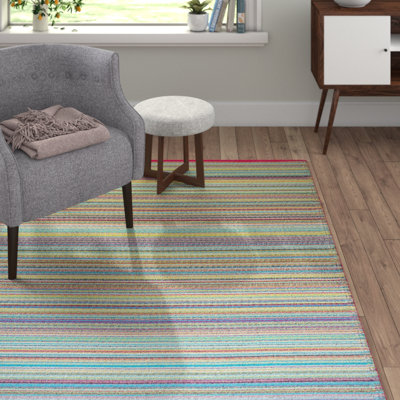 pink and green outdoor rug